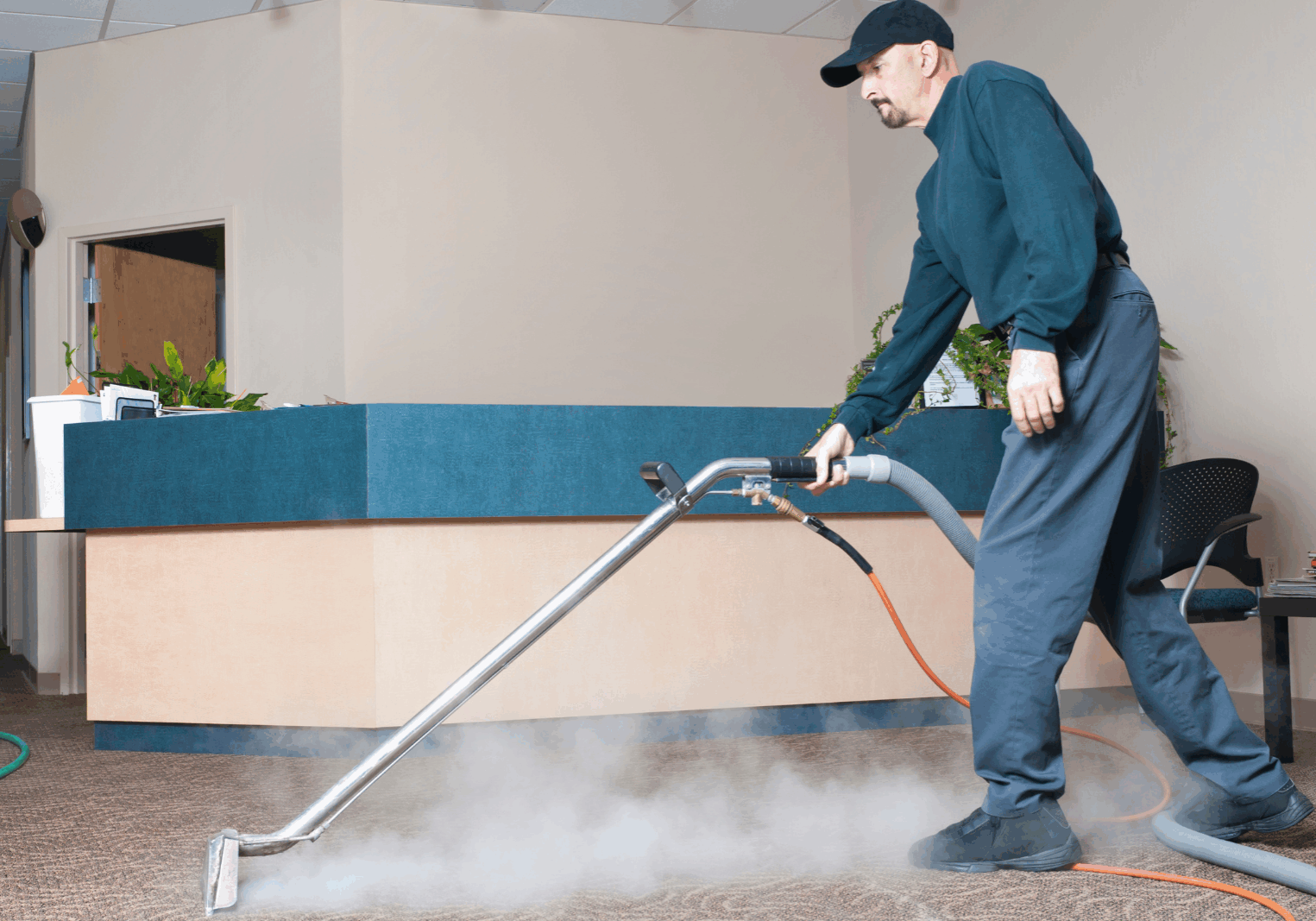 Professional Carpet Cleaner - Man Steam Cleaning Professional Carpet Cleaner - Man Steam Cleaning